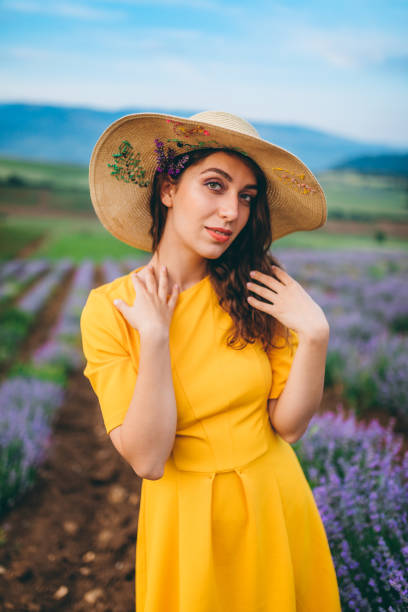 Portrait of young Caucasian beautiful woman in lavender field.