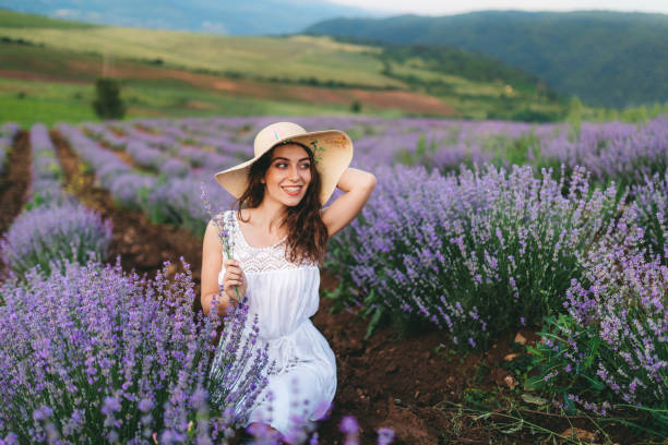 istock Young joyful woman in lavender field 1201152721