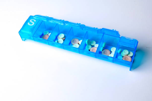 istock seven day pill box with pills isolated on white background 1201153433