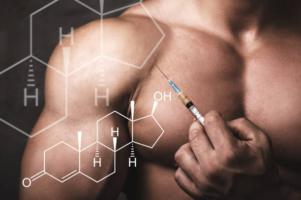 muscular man with a syringe in his hand and testosterone formula. - steroids imagens e fotografias de stock