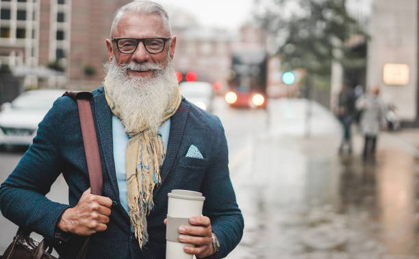 istock Senior business man going to work - Hipster entrepreneur drinking coffee while waiting bus - Job, leadership, fashion and confident concept - Focus on face 1201154657