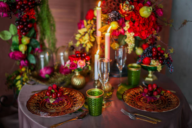 istock Table decorated with artificial fruits and candles 1201154864
