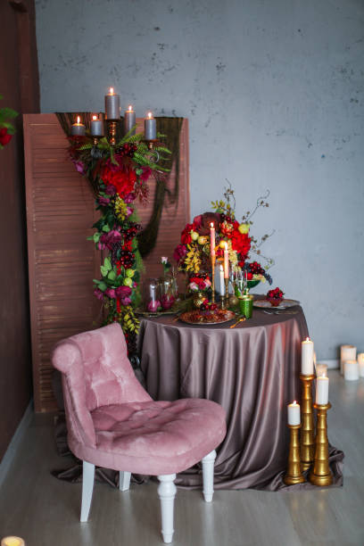 istock Table decorated with artificial fruits and candles 1201154949