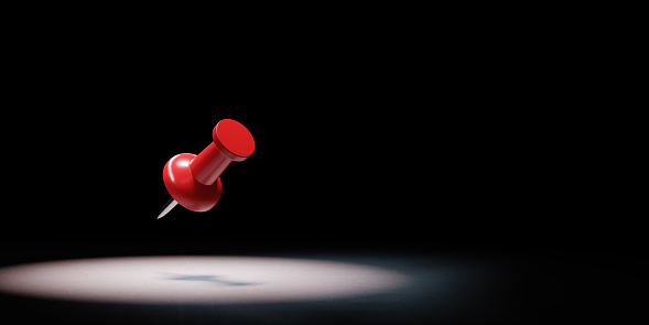 Single Red Pushpin Spotlighted on Black Background with Copy Space 3D Illustration