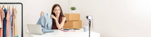 Asian Fashion blogger recording and making a video. Smiling Asian Fashion female blogger recording and making a video. Online, Owner Business, panoramic, web, banner. home recording studio setup stock pictures, royalty-free photos & images