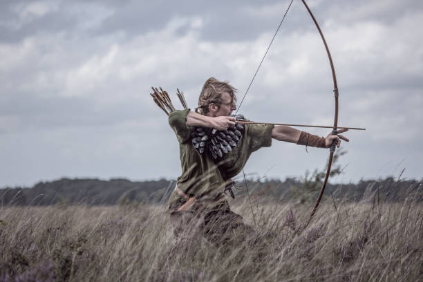 A individual redhead viking archer warrior in the north European countryside