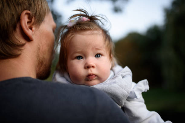 istock Young father having fun with his little daughter in park 1201162074