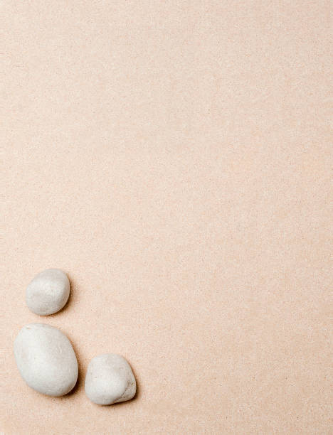 istock set sea stones, on sand beach background, top view 1201162599