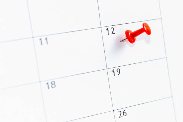 istock 12 date on calendar marked with red thumbtack. Save the Date concept. 1201166717