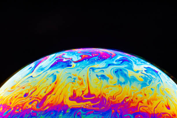 istock Macro shot of a soap bubble hemisphere. Abstract colorful liquid background. 1201166761