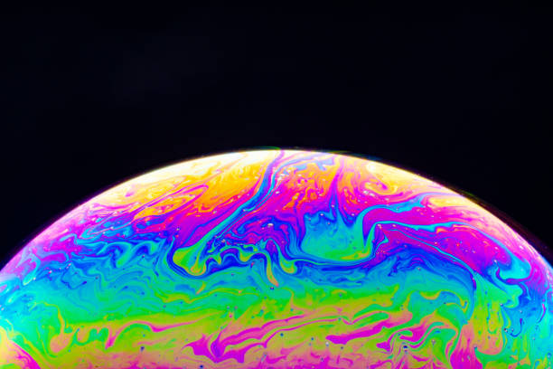 istock Macro shot of a soap bubble hemisphere. Abstract colorful liquid background. 1201166762