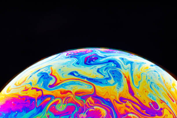 istock Macro shot of a soap bubble hemisphere. Abstract colorful liquid background. 1201166764