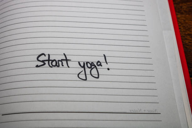 istock Start yoga, handwriting text on page of office agenda. Copy space. 1201166869