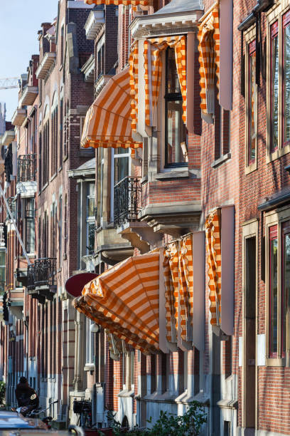 istock Nostalgic street with bay windows and awnings 1201166970