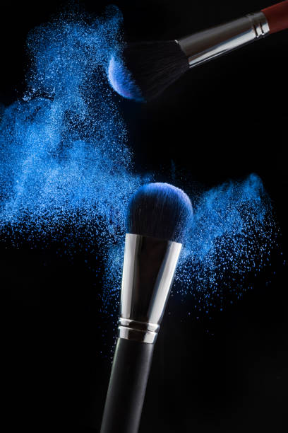 istock Professional brushes and blue powder on a black background. Make-up, Cosmetics. 1201167021