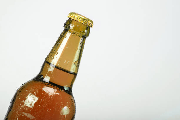 istock The beer bottle on a gray background is closed. Low alcohol drinks 1201167060