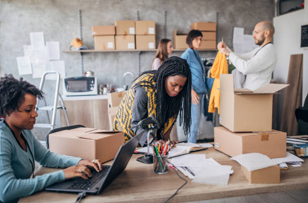 istock Diverse group of people arranging customers orders for drop shipping 1201168060