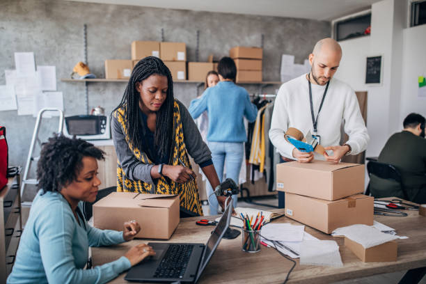 istock Diverse group of people arranging customers orders for drop shipping 1201168093