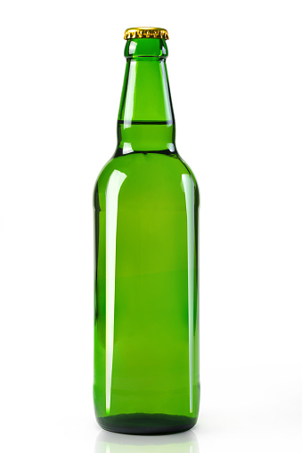 Glass bottle on white background close-up. alcohol, lemonade