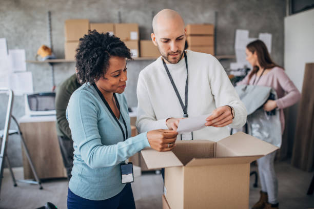 istock Diverse group of people arranging customers orders for drop shipping 1201168479
