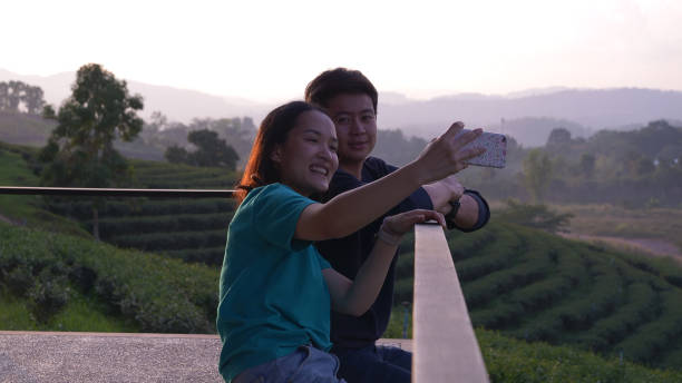 istock Asian People Relaxing in Nature 1201171341
