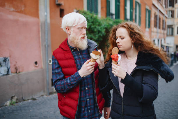 istock Young couple on a date eating gelato 1201172343