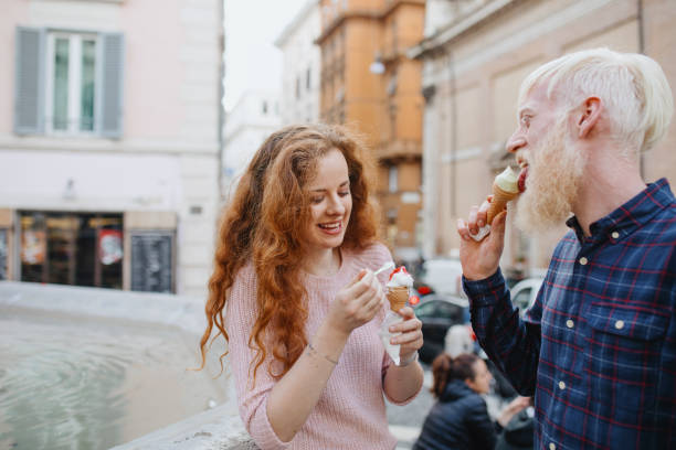 istock Young couple on a date eating gelato 1201172370