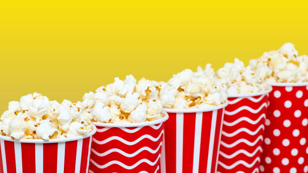 istock Closeup of several red paper baskets with popcorn 1201172707