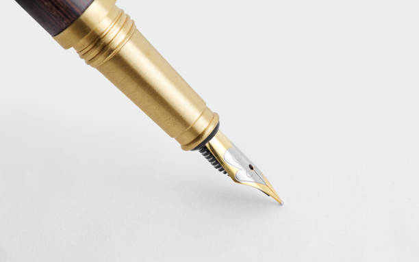 istock fountain pen on a white paper with clipping path 1201174098