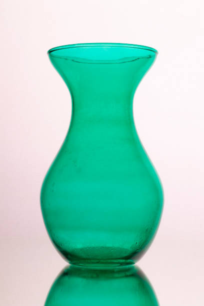 istock green glass vase on a white background. 1201175864