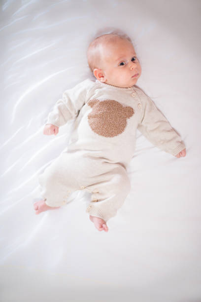 istock Newborn child relaxing in bed. 1201176086
