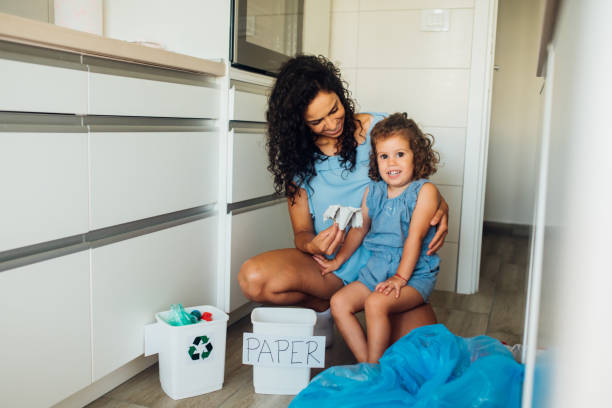 istock Girl and her mom recycling and having fun 1201177304