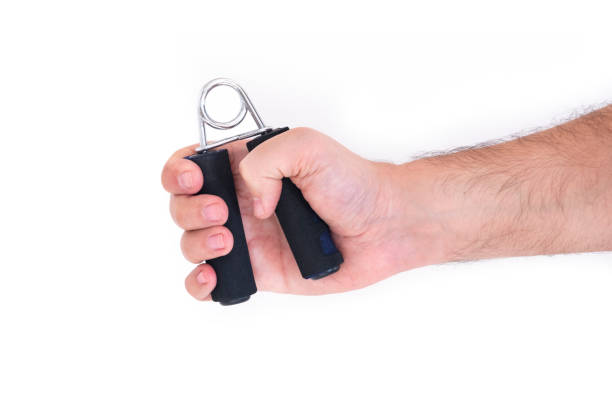 istock Male Hand Using Muscle Exercising Grip Isolated On White Background 1201177448
