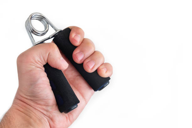 istock Male Hand Using Muscle Exercising Grip Isolated On White Background 1201177477