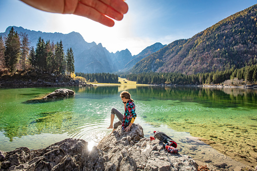 Enjoyment and Relaxation By a Lake in Mountains.