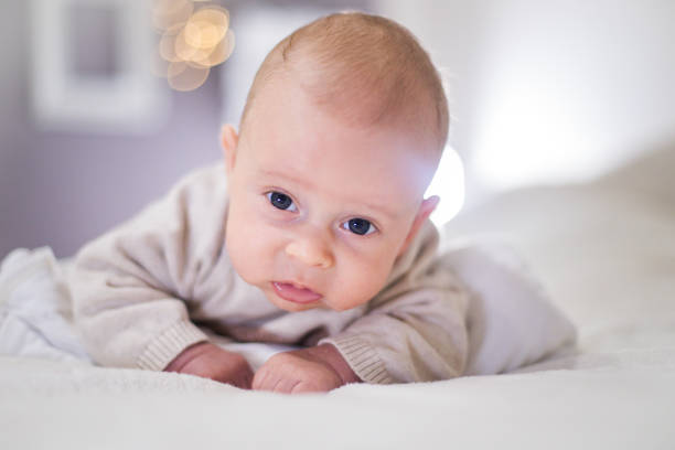 istock Newborn child relaxing in bed. 1201179784