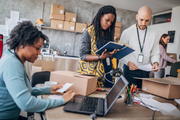 istock Diverse group of people arranging customers orders for drop shipping 1201181408