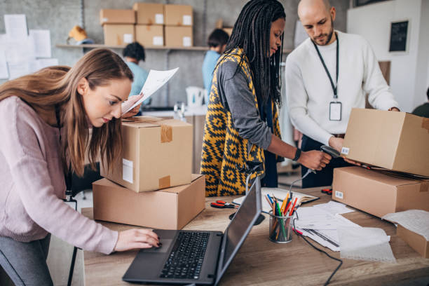 istock Diverse group of people arranging customers orders for drop shipping 1201181714