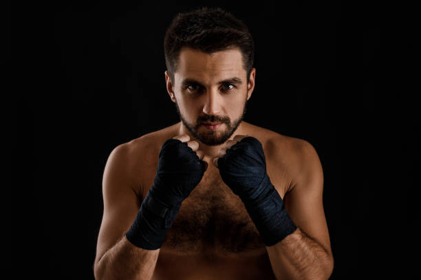 istock Muscular boxing man ready to fight. 1201184489