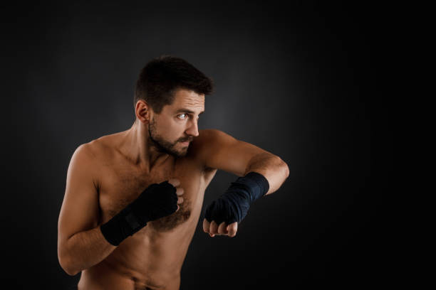 istock boxer man shows the different movements on black background 1201184531