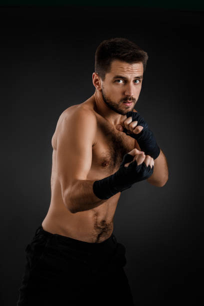 istock boxer man shows the different movements on black background 1201185240