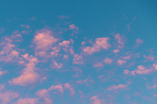 View of pink rose clouds and turquoise sky - like a cotton candy, zephyr, vanilla