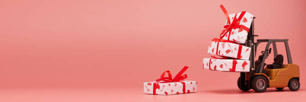 istock Forklift and gift boxes on pink background with copy space. Valentine's Day. 1201187080