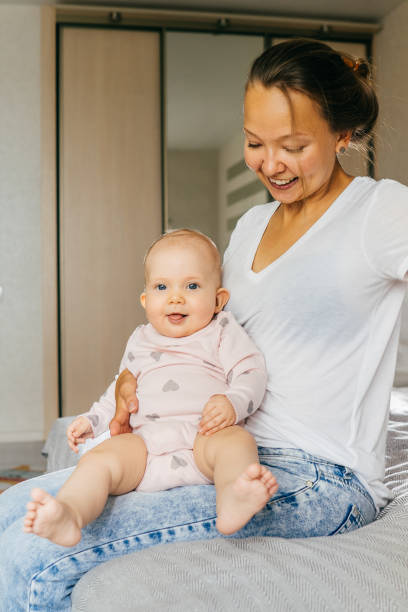 istock Happy young mother with baby. 1201187087