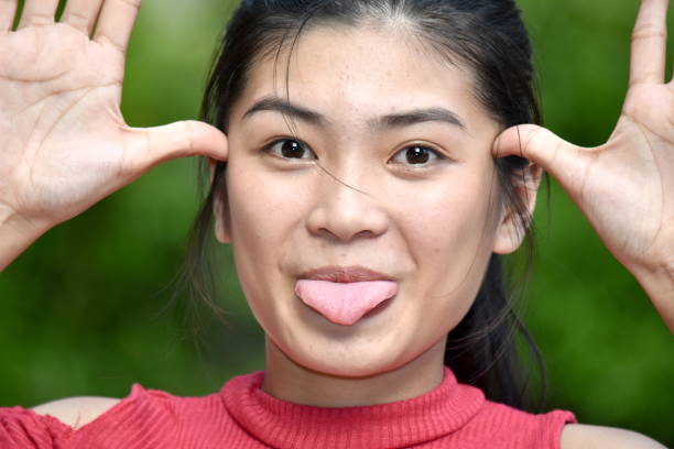 istock A Filipina Female Making Funny Faces 1201188432