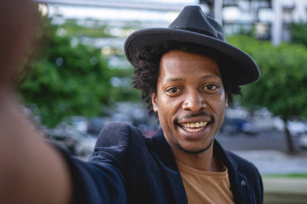 istock Joyful African American man taking selfie 1201190221