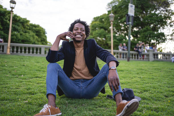 istock Joyful African American tourist talking on mobile phone 1201190714