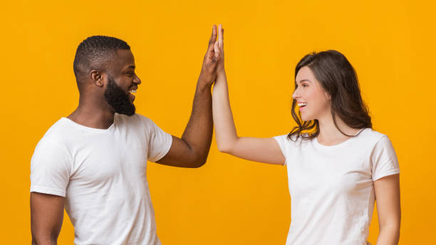 istock Happy Interracial Couple Giving Each Other High Five, Clapping Palms 1201191674