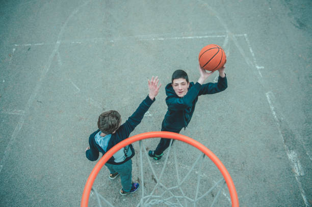 istock Playing Basketball Outdoors 1201191711