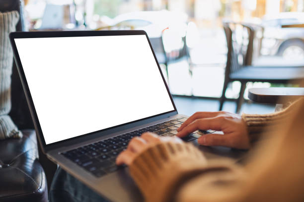 istock a woman using and typing on laptop computer with blank white desktop screen 1201191776